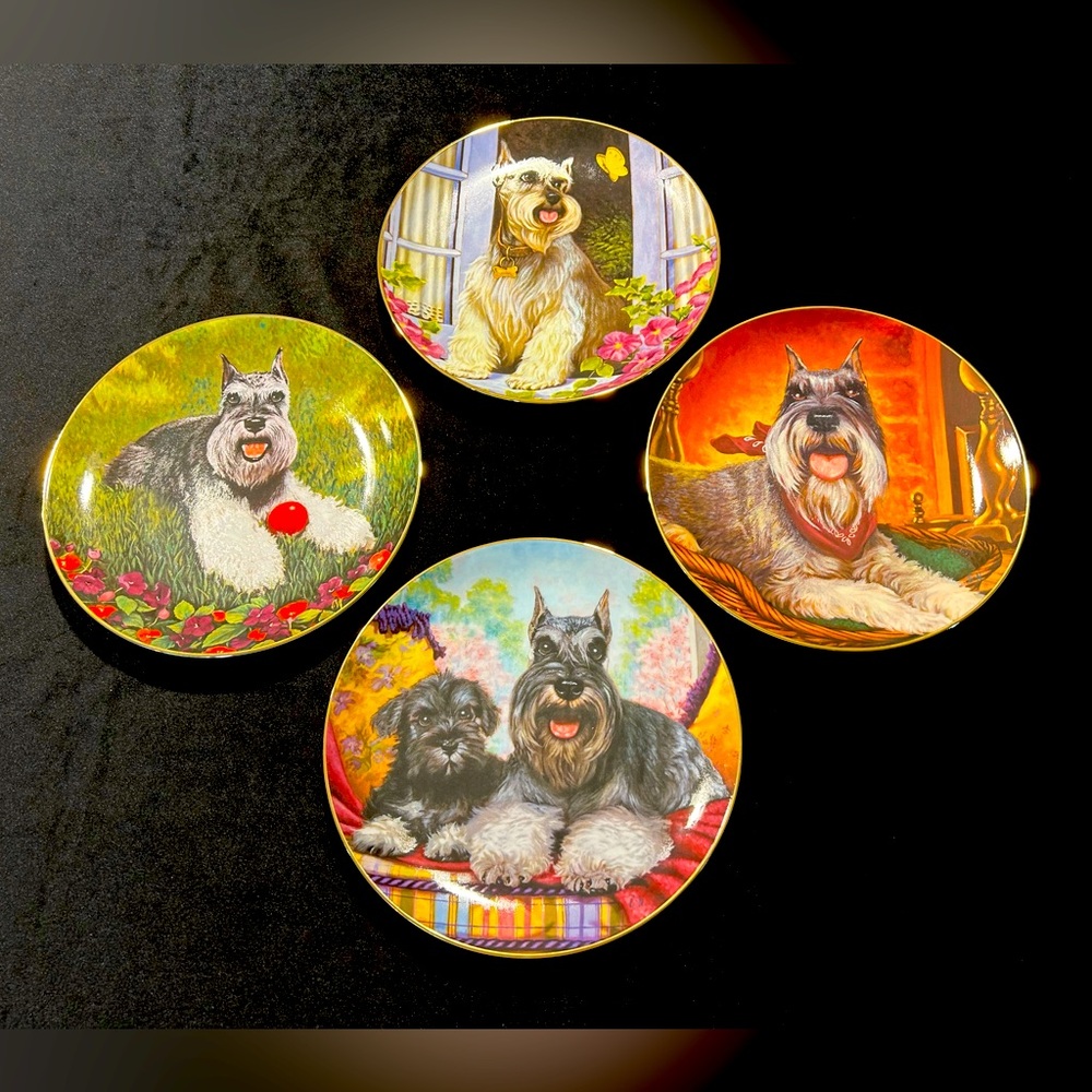 A set of four Danbury Mint “Miniature Schnauzers” collection plates